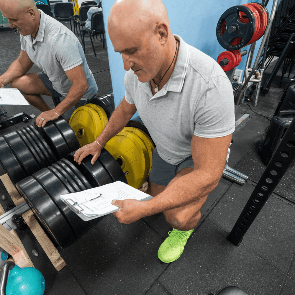 FitSafe inspector in a gym setting testing weights and exercise equipment