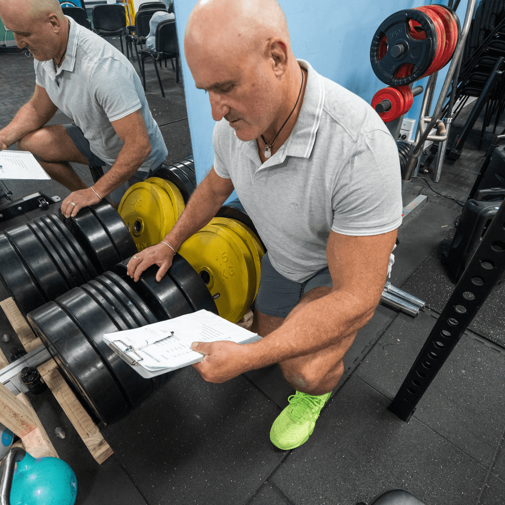 FitSafe inspector in a gym setting testing weights and exercise equipment